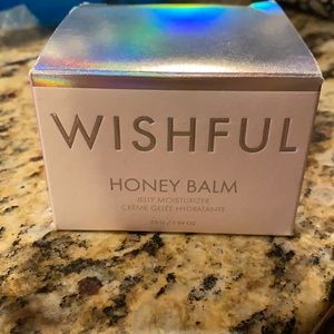 Huda Beauty Wishful Honey Balm moisturizer.